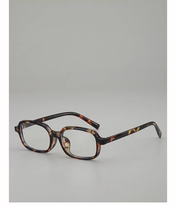Detail of vintage tortoise shell rectangular sunglasses with metallic hinge rivets
