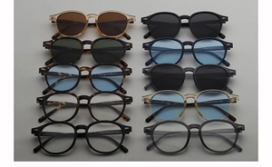 Flat lay display of retro oval sunglasses collection in various frame colors and lenses