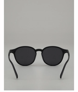 Front view of vintage oval sunglasses with sleek black frames and grey lenses