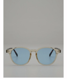 Detail of vintage oval sunglasses with champagne frame and light blue lenses