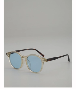 Detail of vintage oval sunglasses with yellow frames and blue lenses on grey background