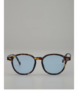 Detailed view of vintage tortoiseshell oval sunglasses with blue lenses and silver rivets