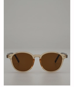 Close-up of vintage oval sunglasses with amber frames and silver metal hinges