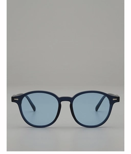 Close-up of vintage oval sunglasses with blue frames and silver metallic side accents