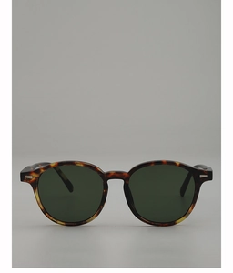 Macro detail of retro oval sunglasses with tortoiseshell texture and metal rivets