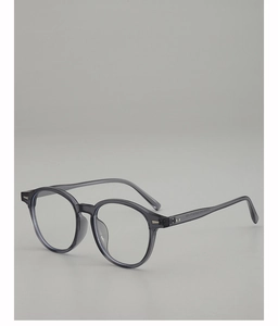 Macro view of grey transparent oval frame with metal rivets and size details on temple