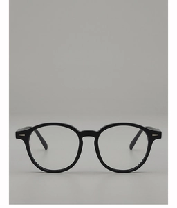 Close-up of vintage oval black frames with silver rivet detail and polished finish