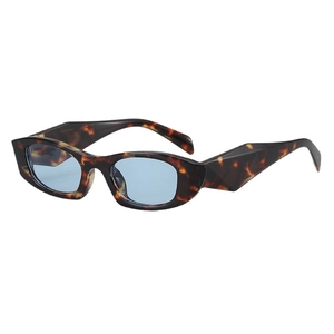 Retro tortoise shell cat eye sunglasses with thick temples and light blue lenses