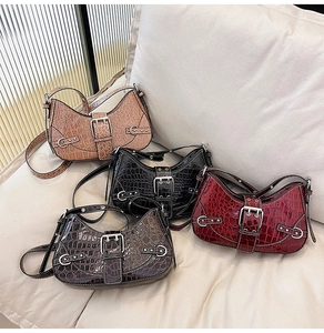 Detail showing four retro crocodile pattern bags in brown, black, wine red, and coffee