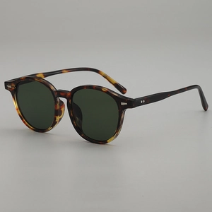 Retro oval sunglasses with leopard print frame and dark green lenses in a 45-degree view
