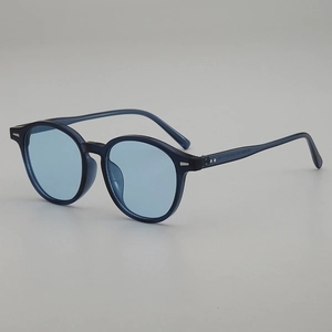 Vintage oval sunglasses with blue translucent frames and lenses for UV protection