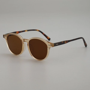 Vintage oval sunglasses with amber frame and tortoiseshell temples for UV protection