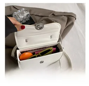 Close-up of leather crossbody bag interior showing spacious storage for daily essentials