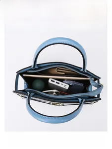 Top view of spacious light blue tote bag showing storage for iPad, umbrella, and wallet