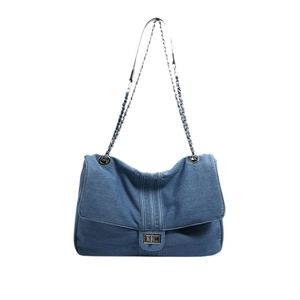 Chic quilted denim crossbody bag with silver chain strap and metal swivel lock closure