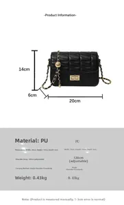 Detail view of black quilted crossbody bag with gold hardware and dimensions 20x14x6cm