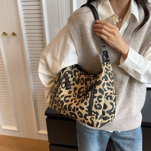 Stylish leopard print canvas shoulder bag for women with leather straps and zip pockets