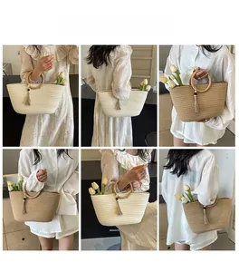 Detailed views of woven shoulder bags with round handles and decorative fringe tassels