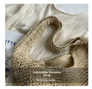 Detail of cream woven shoulder bag with adjustable strap and smooth inner lining