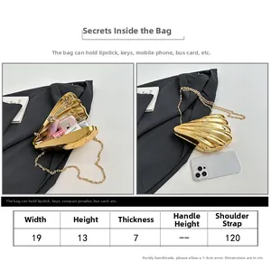 Detailed size chart and view of shell-shaped gold evening clutch with chain strap