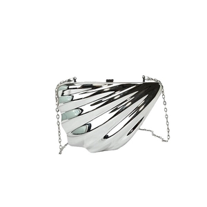 Chic silver shell-shaped metallic crossbody clutch bag with elegant chain strap