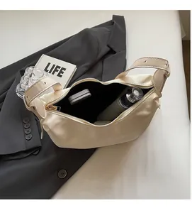 Detailed interior of cream crossbody bag showcasing spacious storage for cosmetics