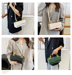 Detail view of crocodile pattern crossbody bags with elegant gold metal handles in 4 colors