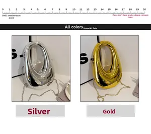 Detailed size view of silver and gold metallic clutch bags with 20cm scale ruler