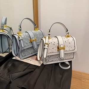 Elegant rhinestone crossbody bag for women with top handle and gold T-shaped clasp