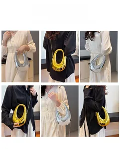 Metallic dumpling bag detail showing multiple ways to wear with chain strap and handle