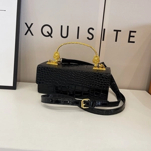 Elegant black crocodile pattern box bag with gold metal handle and logo emblem detailing