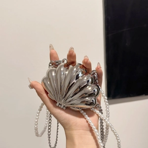 Elegant silver shell clutch bag with white pearl strap and metallic mirror finish