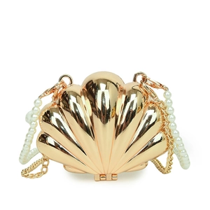 Elegant gold shell evening clutch bag with pearl handle and metal chain strap