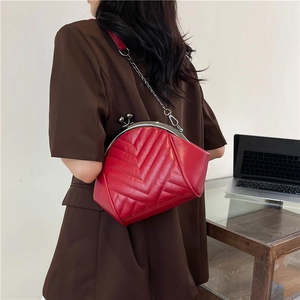 Red quilted leather shell bag with metal chain strap and vintage clasp closure