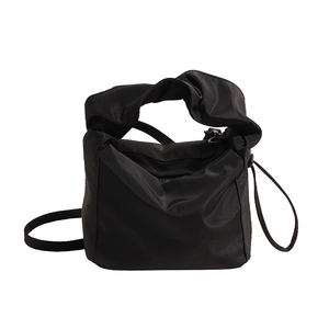 Black nylon cloud-shaped shoulder bag with ruched handle and crossbody strap