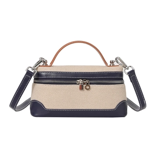 Chic canvas contrast stitching crossbody bag with leather handles and silver hardware details