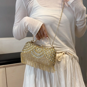 Elegant gold rhinestone evening bag with luxury metallic tassels and chain shoulder strap