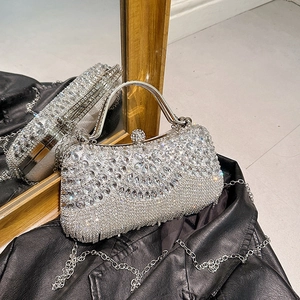 Sparkling silver evening bag with rhinestones and metal handle for elegant gala events