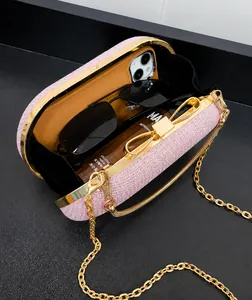 Top view of pink sequin evening bag showing interior space for phone and makeup