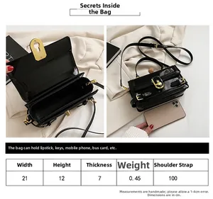Vue détaillée du sac bandoulière en cuir verni noir avec dimensions et compartiments