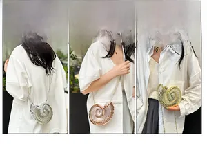 Three metallic shell-shaped clutch bags in silver, gold, and rose gold with chain straps