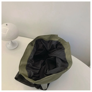 Internal view of the olive green nylon tote bag featuring multi-pocket storage and magnetic buckle