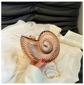 Nautilus shell metal clutch bag in rose gold with chain strap and spiral texture