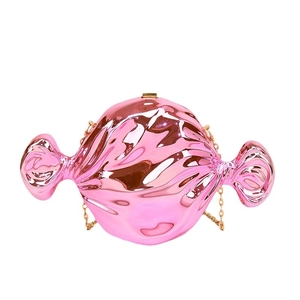 Pink candy shaped evening clutch bag with glossy metallic finish and gold chain strap