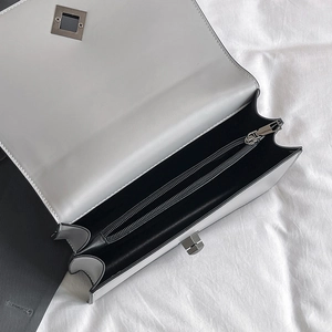 White snake pattern chain bag with silver twist lock and spacious interior