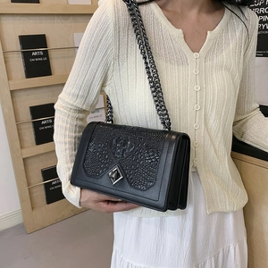 Fashionable black crocodile pattern shoulder bag with silver chain strap and buckle