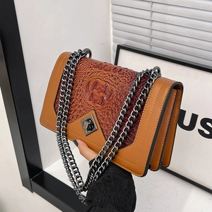 Brown crocodile embossed chain crossbody bag with dual compartments and metal lock