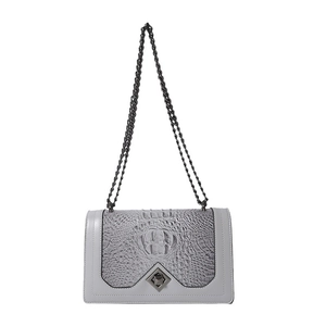 Light gray chain bag with crocodile embossing and metallic twist lock on the front