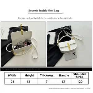 Size guide for white saddle bag showing 21x13x7cm dimensions and internal capacity space