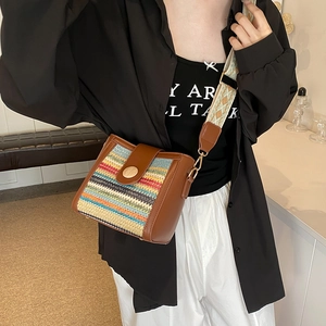 Striped woven crossbody bag with leather trim and wide jacquard shoulder strap